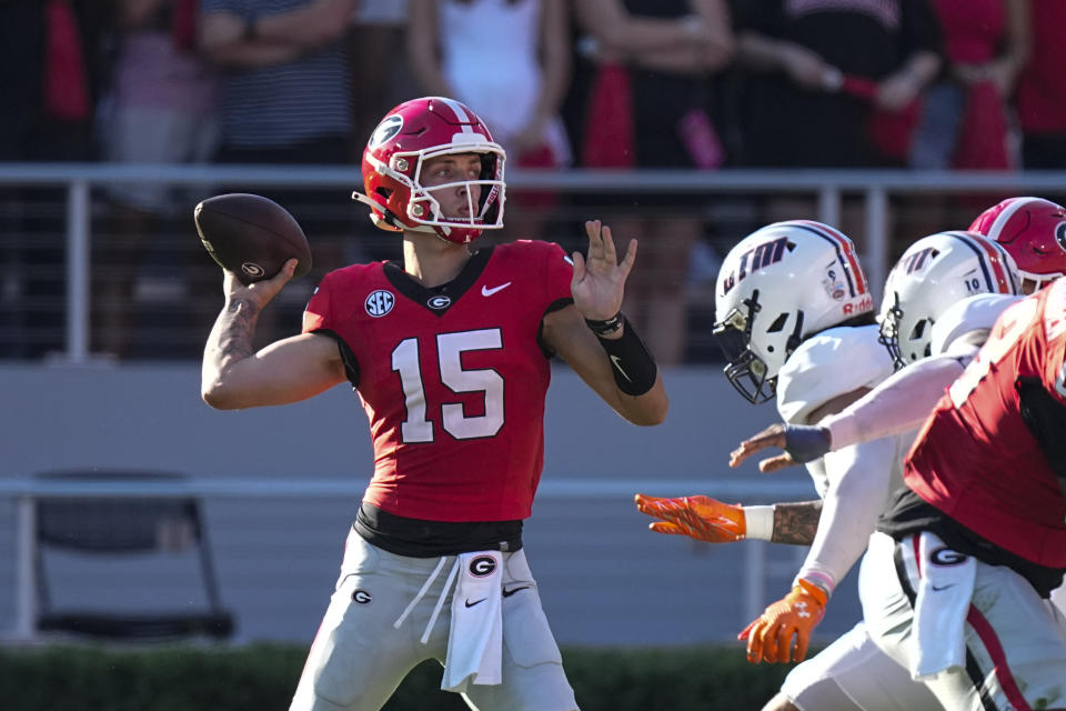 Georgia quarterback Carson Beck (15) throws from the pocket during the first half of an NCAA college football game against Tennessee-Martin, Saturday, Sept. 2, 2023, in Athens, Ga. (AP Photo/John Bazemore)