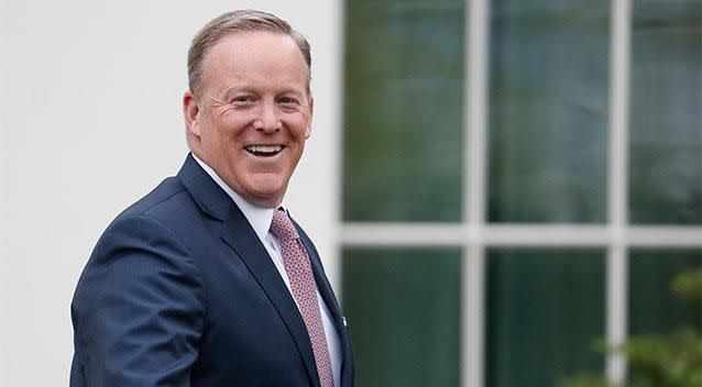 A smiling Sean Spicer departs the White House. Photo: AAP