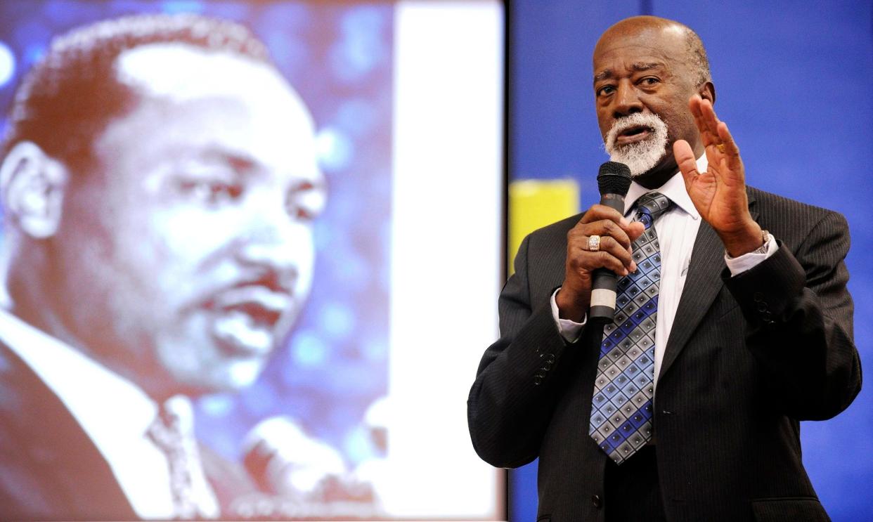 Anthony Brooks Sr. talks with students at Spottsville Elementary School in January 2011.