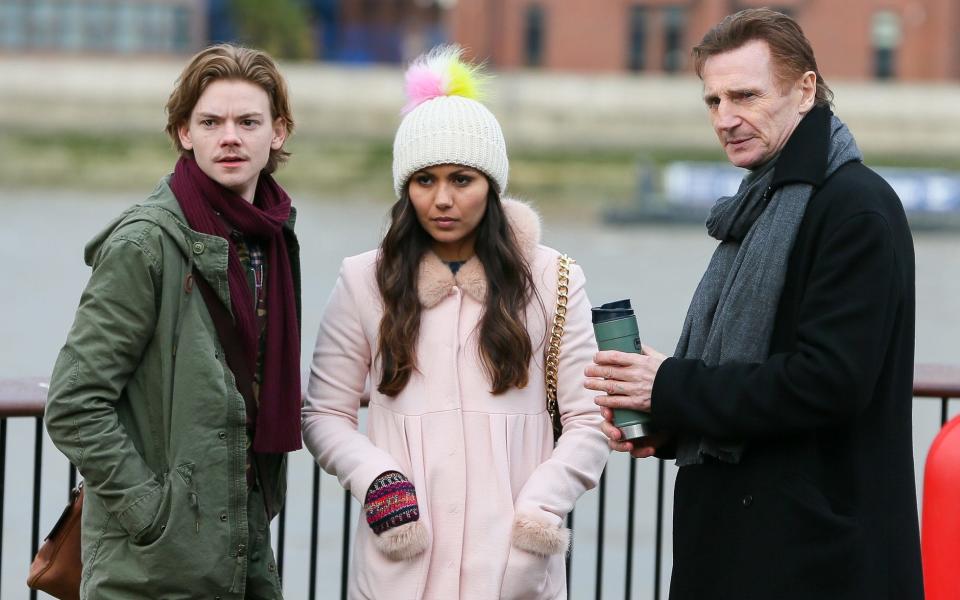 Liam Neeson reunites with his on screen son Thomas Brodie-Sangster and Olivia Olsen while filming Love Actually 2 for Comic Relief - Credit: The Mega Agency