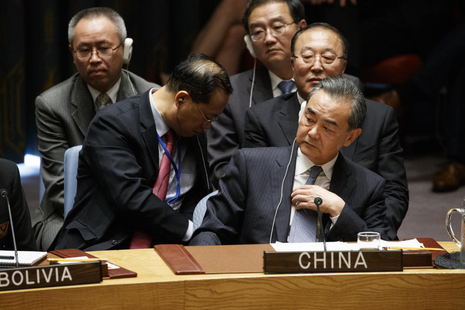 Chinese Foreign Minister Wang Yi listens as President Donald Trump speaks during a United Nations Security Council briefing on counterproliferation at the United Nations General Assembly, Wednesday, Sept. 26, 2018, at U.N. Headquarters. (AP Photo/Evan Vucci)