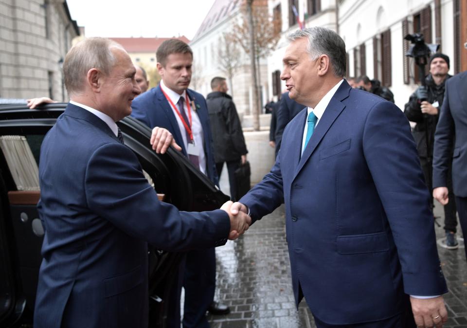 Hungarian Prime Minister Viktor Orban, right, greets Russian President Vladimir Putin upon his arrival in Budapest, Hungary, Wednesday, Oct. 30, 2019. Hungary has maintained friendly ties with Russia and long criticized the European Union's sanctions against Moscow. (Alexei Nikolsky, Sputnik, Kremlin Pool Photo via AP)