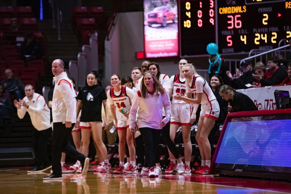 Ball State women's basketball associate head coach Audrey Spencer (middle) brings the intensity on the sideline.