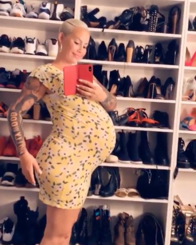 Pregnant Amber Rose proudly shows off huge baby bump as she rocks