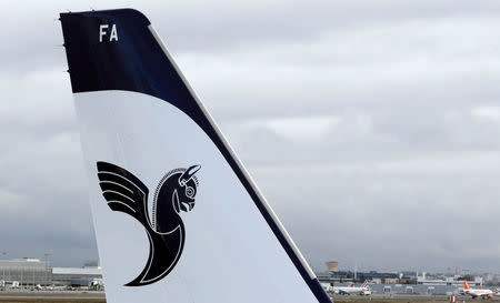 FILE PHOTO: A logo of IranAir is pictured on an Airbus A321 as the company takes delivery of the first new Western jet under an international sanctions deal in Colomiers, near Toulouse, France, January 11, 2017. REUTERS/Regis Duvignau/File Photo