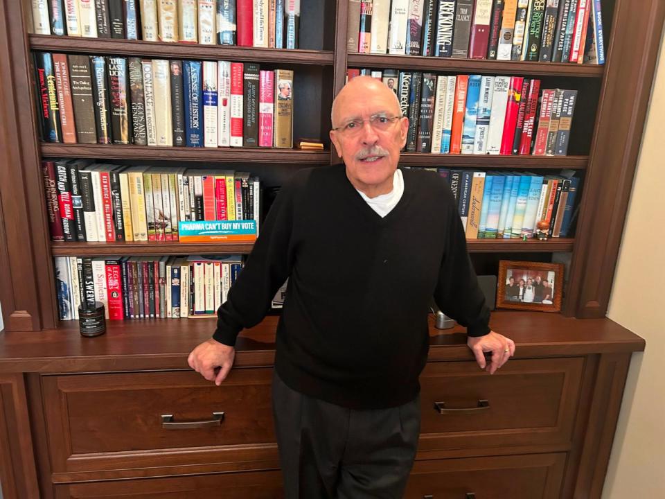 PHOTO: David Mitchell, a multiple myeloma patient since 2010, stands in his home office. Mitchell founded Patients for Affordable Drugs, an advocacy group that helped push through the Biden administration’s measures to control drug prices. (Arthur Allen/KFF Health News)