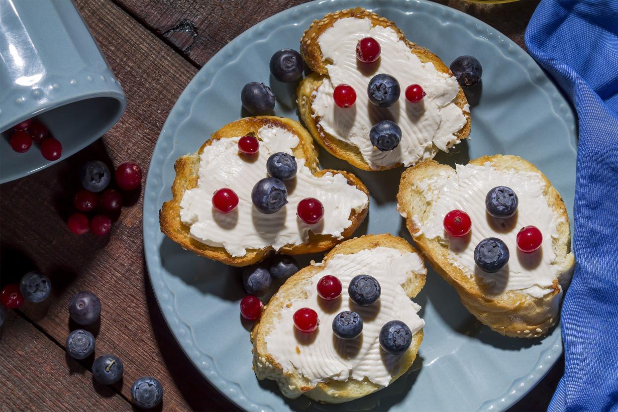 Cream cheese and fresh berries on toast