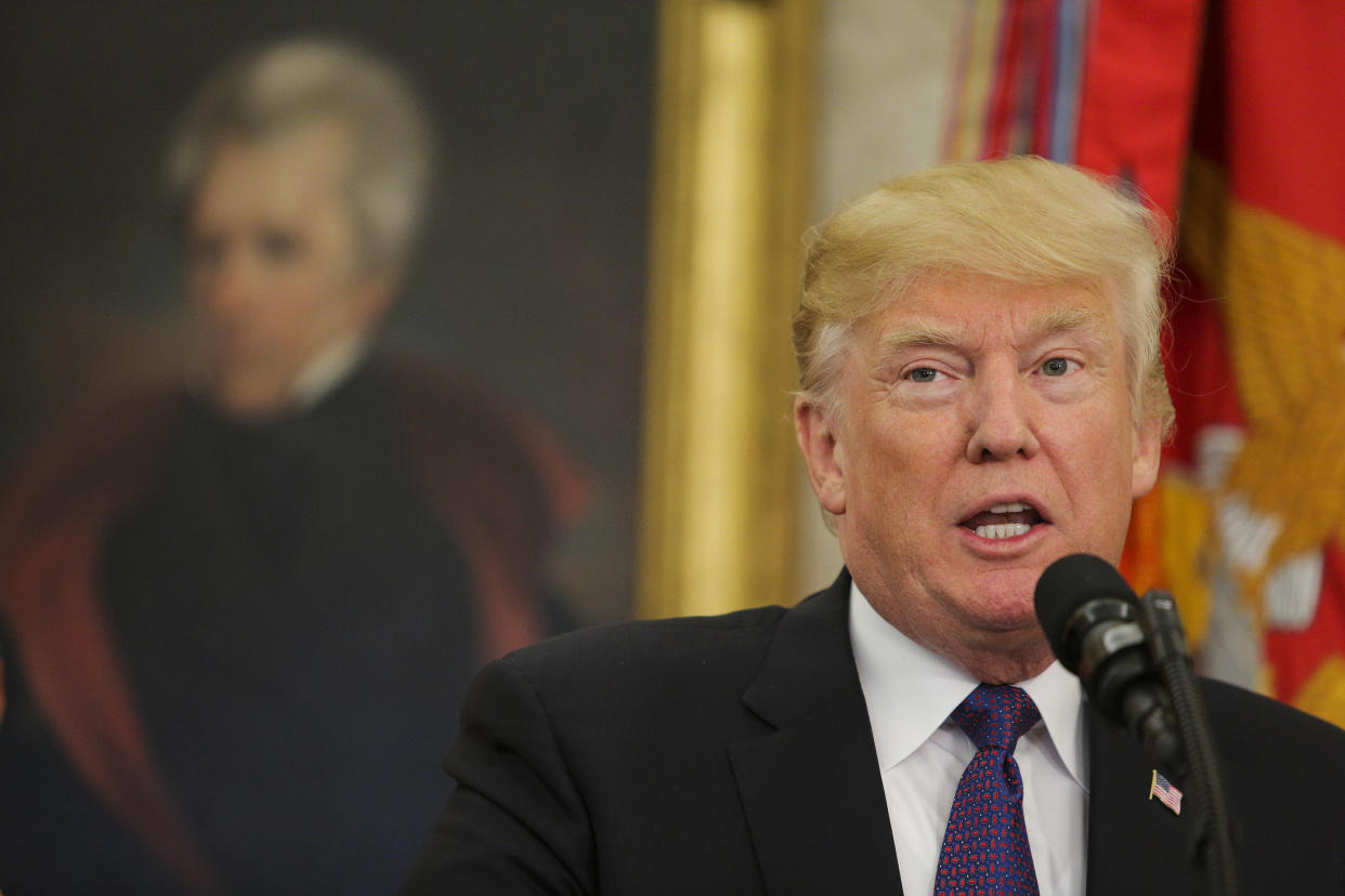 President Donald Trump in front of a portrait of Andrew Jackson, the former president and slave owner who signed the Indian Removal Act that led to the Trail of Tears. Trump chose to put Jackson's portrait in the Oval Office and has said he is "a fan." (Photo: Pool via Getty Images)