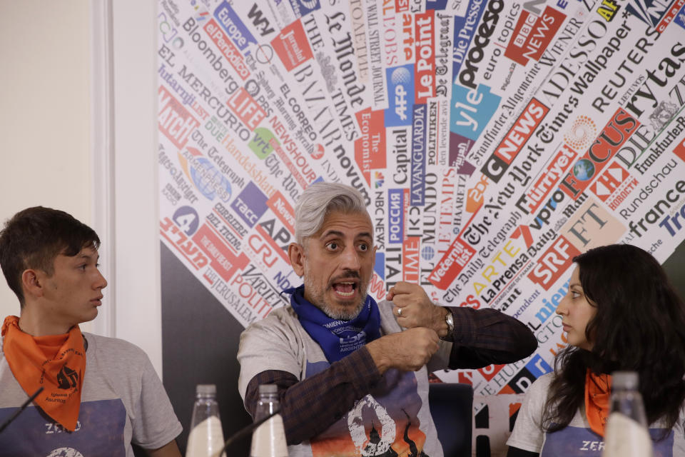 Deaf survivors of clerical sexual abuse from left, Ezequiel Villalonga, Daniel Oscar Sgardelis, and Claudia Labeguerie, answers reporter's questions at the Foreign Press Association in Rome, Thursday, Feb. 20, 2020. On Wednesday, they had a string of meetings with United Nations human rights officials in Geneva, hoping to build pressure on the Vatican, and Pope Francis himself, to come clean about the crimes committed against them, one year after Pope Francis' summit on clergy abuse. (AP Photo/Alessandra Tarantino)