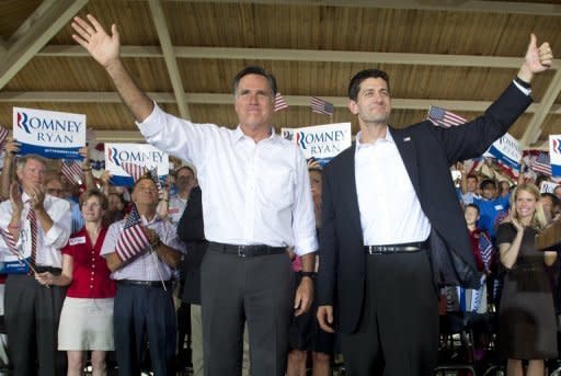 US Republican presidential candidate Mitt Romney (L) and his running mate Paul Ryan wave at a rally in Manassas, Virginia, on August 11. Romney and Ryan will try to energize supporters in North Carolina Sunday after they hit the road on a bus tour across must-win US states, selling themselves as the duo who can "save the American dream."