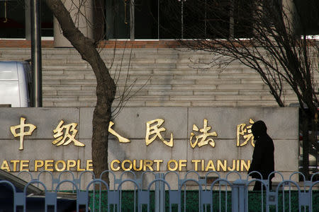 A man walks outside an Intermediate People's Court where prominent rights lawyer Wang Quanzhang is being tried, in Tianjin, China December 26, 2018. REUTERS/Thomas Peter