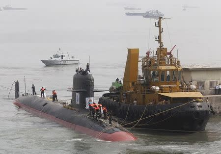 File photo of Indian Navy's Scorpene submarine INS Kalvari being escorted by tugboats as it arrives at Mazagon Docks Ltd, a naval vessel ship building yard, in Mumbai, India, October 29, 2015. REUTERS/Shailesh Andrade/Files