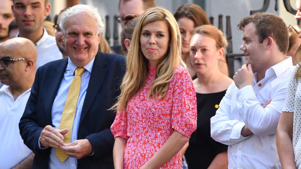 Carrie Johnson wears a pink Ghost dress