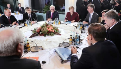 German Chancellor Angela Merkel hosting Russian President Vladimir Putin (l) and Ukrainian President Petro Poroshenko (2nd r) during the last 'Normandy Format' meeting in Berlin in October 2016