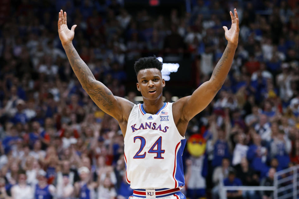 Kansas forward K.J. Adams Jr. (24) reacts after a three-point basket during the first half of an NCAA college basketball game against Oklahoma State, Tuesday, Jan. 30, 2024, in Lawrence, Kan. (AP Photo/Colin E. Braley)