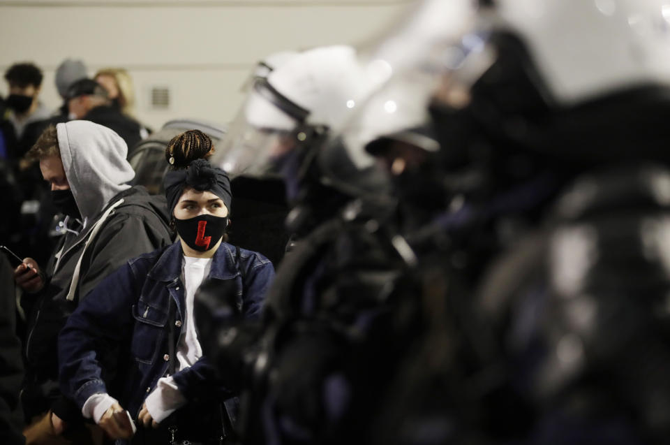 Young people take part in a massive protest against the conservative government on the eighth straight day of angry demonstrations that were triggered by a recent tightening of the abortion law, in Warsaw, Poland, Friday, Oct. 30, 2020. (AP Photo/Czarek Sokolowski)