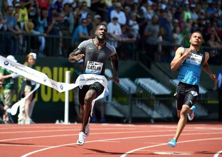 May 28, 2016; Eugene, OR, USA; Justin Gatlin (USA) defeats Andre De Grasse (CAN) to win the 100m in a wind-aided 9.88 during the 42nd Prefontaine Classic at Hayward Field. Mandatory Credit: Kirby Lee-USA TODAY Sports