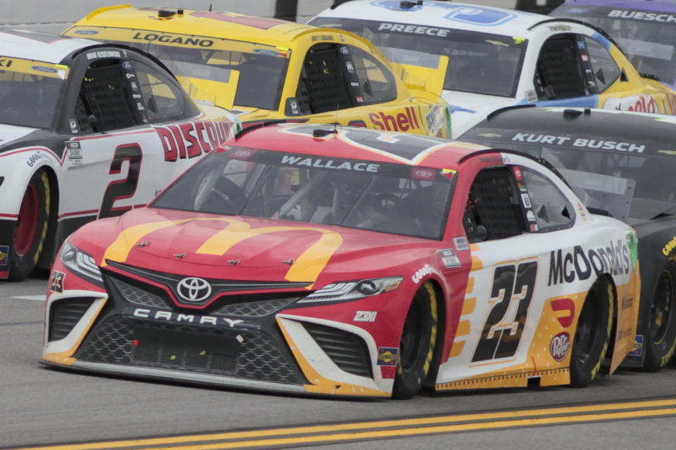 Bubba Wallace runs in the lead during a NASCAR Cup series auto race Monday, Oct. 4, 2021, in Talladega, Ala. Wallace was ahead when a rain delay was called and pronounced the winner when the decesion was made to end the race early. (AP Photo/Greg McWilliams)