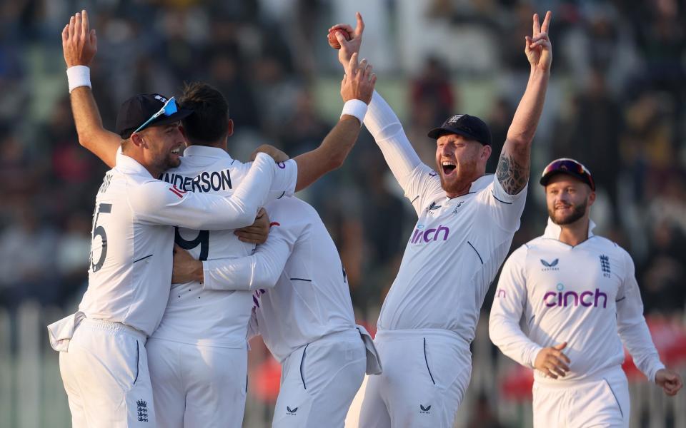 James Anderson of England celebrates with teammates Will Jacks and Ben Stokes after taking the wicket of Haris Rauf of Pakistan during day five of the First Test Match between Pakistan and England at Rawalpindi Cricket Stadium - Getty Images