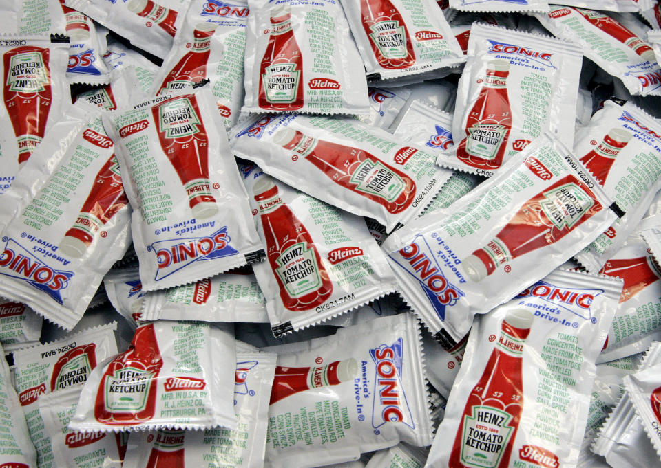 Individual packets of Heinz ketchup are seen at a fast food restaurant in Omaha, Neb. Tuesday, Feb. 28, 2006. H.J. Heinz Co., one of the world's largest food producers, said on Tuesday that its fiscal third-quarter earnings fell 24 percent because of high costs related to downsizing and divestitures.(AP Photo/Nati Harnik)