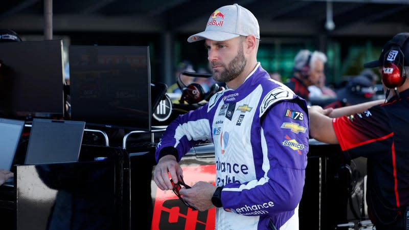 Shane Van Gisbergen, driver of the #91 Enhance Health Chevrolet, looks on in the garage area during practice for the NASCAR Cup Series Verizon 200 at the Brickyard at Indianapolis Motor Speedway on August 12, 2023 in Indianapolis, Indiana.