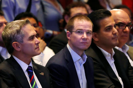 Ricardo Anaya, (C), presidential candidate for the National Action Party (PAN) who is leading a left-right coalition, and the former mayor of Mexico City and present national coordinator for the left-right coalition Miguel Angel Mancera attend an event in Mexico City, Mexico, March 28, 2018. REUTERS/Carlos Jasso