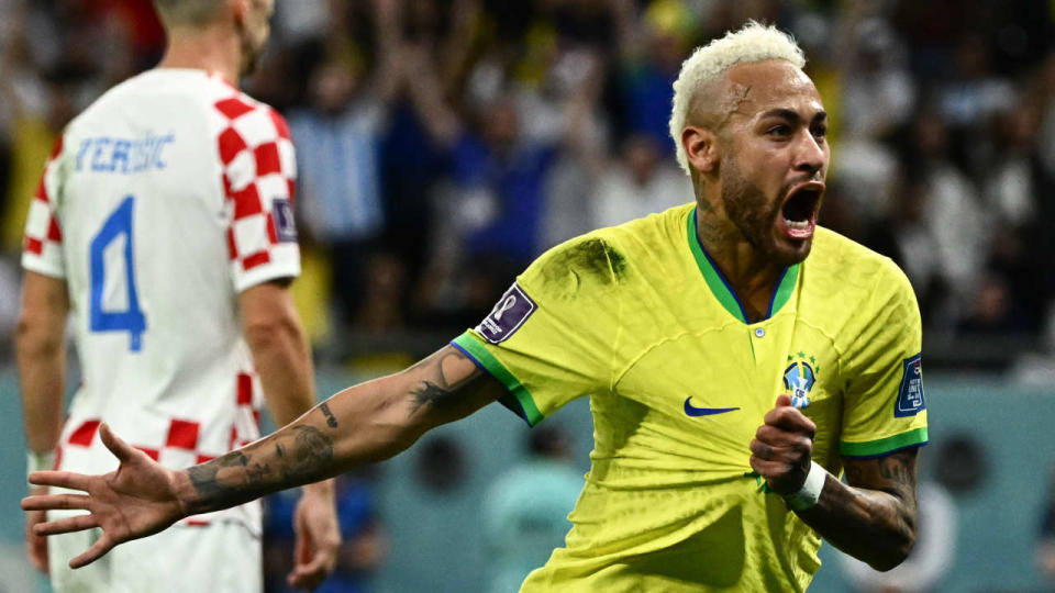 Brazil's forward #10 Neymar celebrates scoring his team's first goal during the Qatar 2022 World Cup quarter-final football match between Croatia and Brazil at Education City Stadium in Al-Rayyan, west of Doha, on December 9, 2022. (Photo by Jewel SAMAD / AFP)