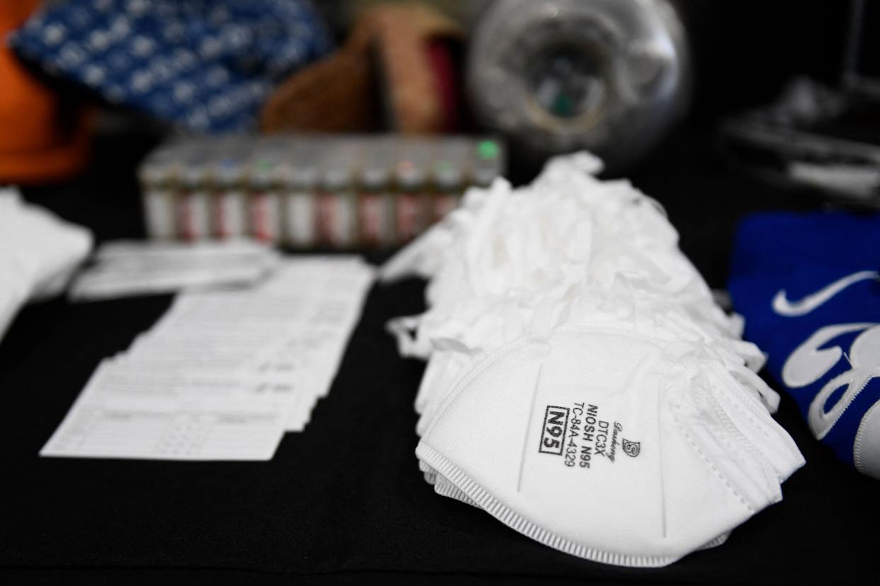 Seized counterfeit CDC Covid-19 vaccination record cards, N95 masks, and unapproved pharmaceuticals are displayed during an opening ceremony for a US Customs and Border Protection (CBP) air dedicated centralized examination station with Custom Specialized Services at Los Angeles International Airport (LAX) on September 16, 2021 in Los Angeles, California. - The new 40,000 sq foot facility is designed to expedite the screening of e-commerce shipments and cargo while intercepting illicit goods including counterfeit products and narcotics through a combination of new scanner technology and CBP officer inspections. (Photo by Patrick T. FALLON / AFP) (Photo by PATRICK T. FALLON/AFP via Getty Images) ORG XMIT: 0 ORIG FILE ID: AFP_9MZ4GE.jpg