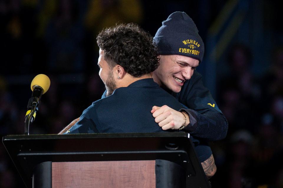 Michigan quarterback J.J. McCarthy (9) hugs running back Blake Corum (2) during the national championship celebration at Crisler Center in Ann Arbor on Saturday, Jan. 13, 2024.