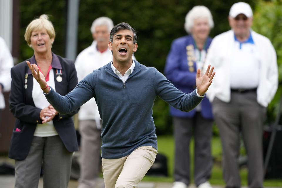 FILE - Britain's Prime Minister Rishi Sunak reacts after bowling during a Conservative general election campaign event at the Market Bosworth Bowls Club in Market Bosworth, England, Tuesday, May 28, 2024 . (AP Photo/Alastair Grant, Pool, File)