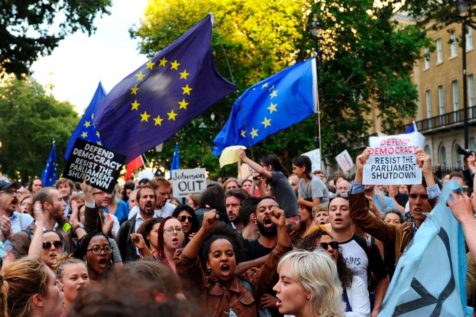 Anti-Brexit demonstrators hold placards as they protest outside of Downing Street (AFP/Getty Images)