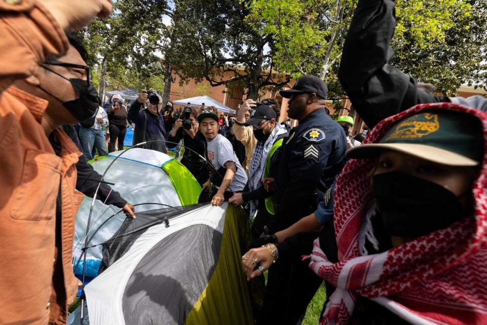 Campus safety officers try to confiscate tents