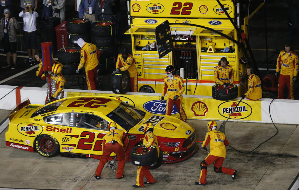 Joey Logano makes a pit stop during the NASCAR Cup Series auto race at Richmond Raceway in Richmond, Va., Saturday, April 13, 2019. (AP Photo/Steve Helber)