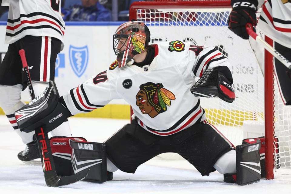 Chicago Blackhawks goaltender Arvid Soderblom makes a save against the Buffalo Sabres during the first period of an NHL hockey game Thursday, Jan. 18, 2024, in Buffalo, N.Y. (AP Photo/Jeffrey T. Barnes)