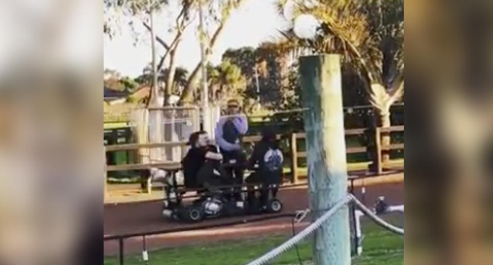 The four friends on the motorised picnic table were stopped by Police after visiting three wineries in Perth's Swan Valley