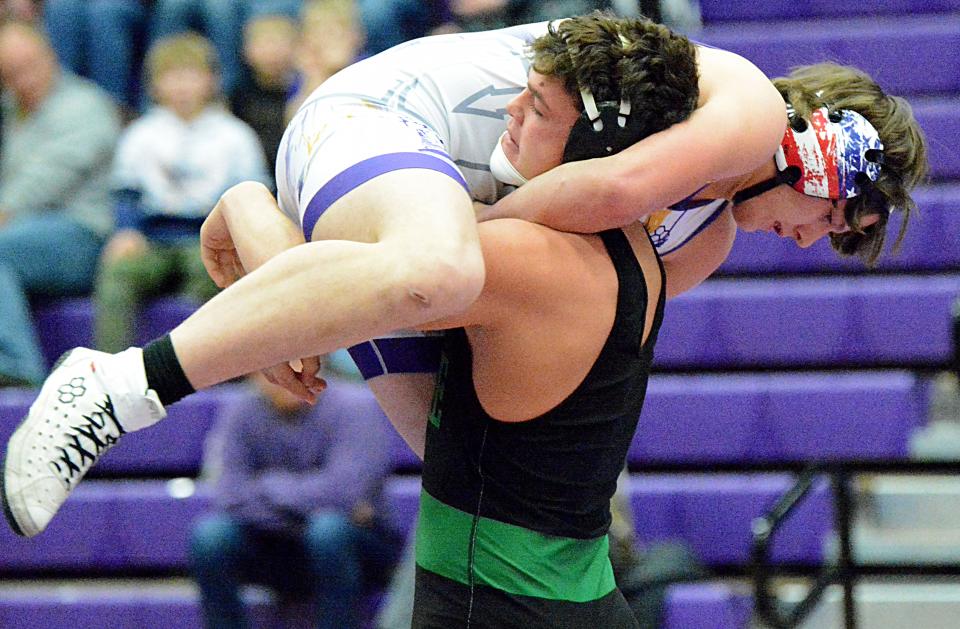 Pierre's Elijah Boutchee lifts Watertown's Matthew Peters during their 220-pound match in an Eastern South Dakota Conference wrestling dual on Thursday, Jan. 12, 2023 in the Civic Arena.