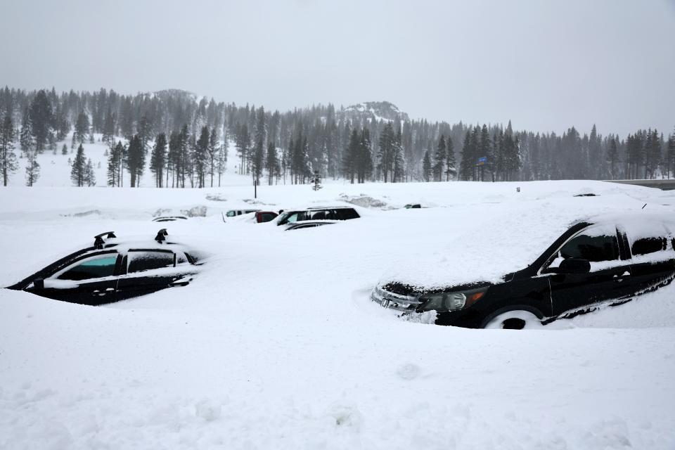 Vehicles are covered in snow at Boreal Mountain Resort, currently shuttered due to the storm, following a massive snowstorm in the Sierra Nevada mountains on March 04, 2024 in Soda Springs, California.