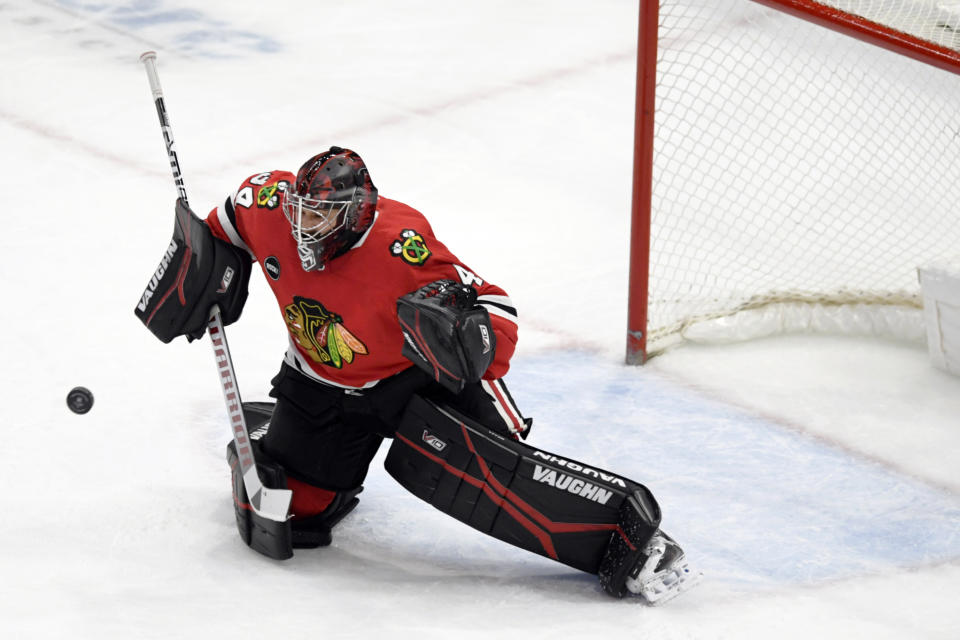 Chicago Blackhawks goalie Petr Mrazek (34) makes a save during the first period of an NHL hockey game against the San Jose Sharks Tuesday, Jan 16, 2024, in Chicago. (AP Photo/Paul Beaty)