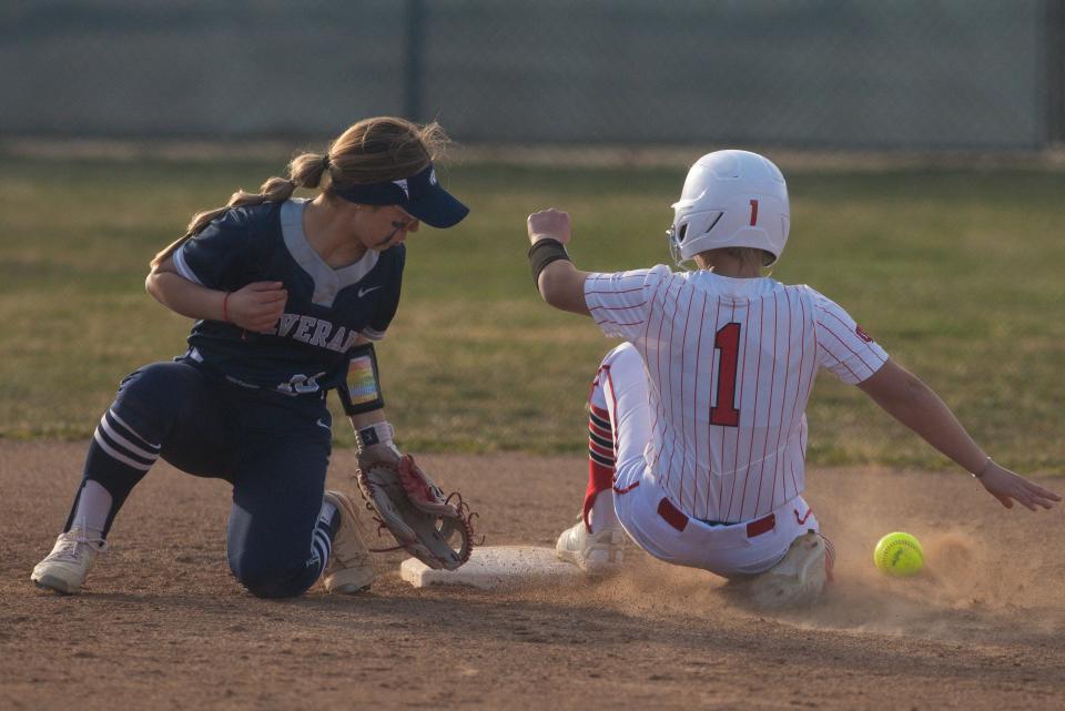 Oak Hills' Marley Fic slides in safely at second base past Silverado’s Alexandra Valdez during the fifth inning on Thursday, March 9, 2023.