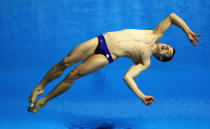 LONDON, ENGLAND - FEBRUARY 22: Reuben Ross of Canada dives in the Men's 3m Springboard Final during day three of the 18th FINA Visa Diving World Cup - LOCOG Test Event for London 2012 at the Aquatics Centre on February 22, 2012 in London, England. (Photo by Bryn Lennon/Getty Images)