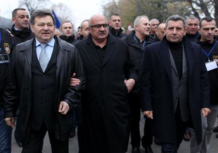 Former generals Mladen Markac (L), Ivan Cermak (C) and Ante Gotovina (R) attend a ceremony to mark the 22th anniversary of Vukovar's fall, in downtown Vukovar November 18, 2013. REUTERS/Antonio Bronic