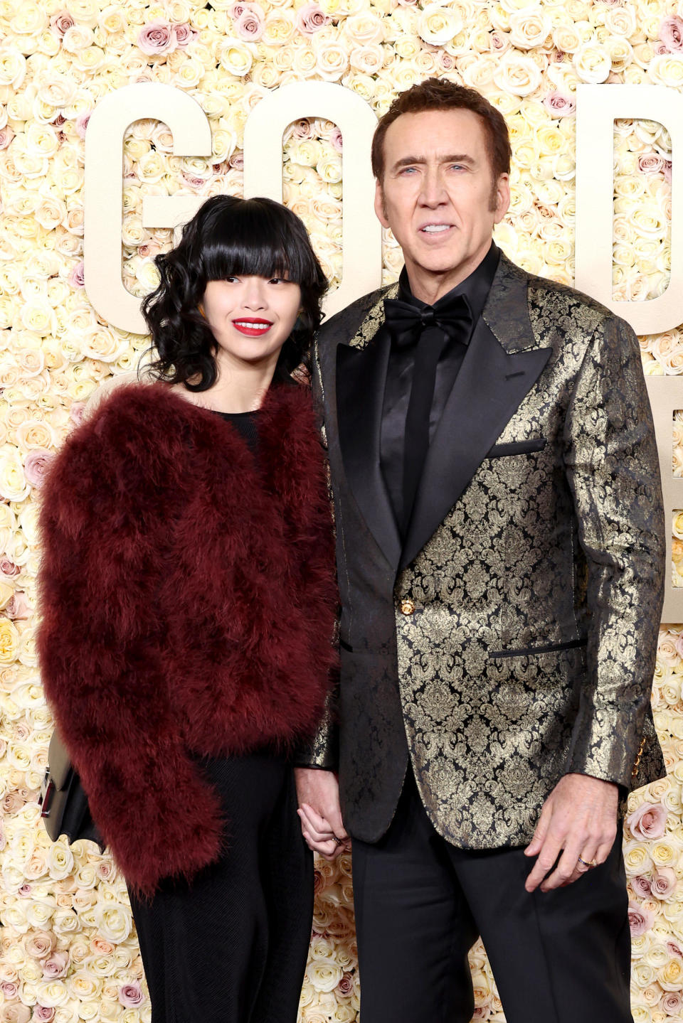 Riko Shibata and Nicolas Cage attend the 81st Annual Golden Globe Awards at The Beverly Hilton on January 7, 2024 — Cage's 60th birthday. / Credit: Monica Schipper/GA/The Hollywood Reporter via Getty Images