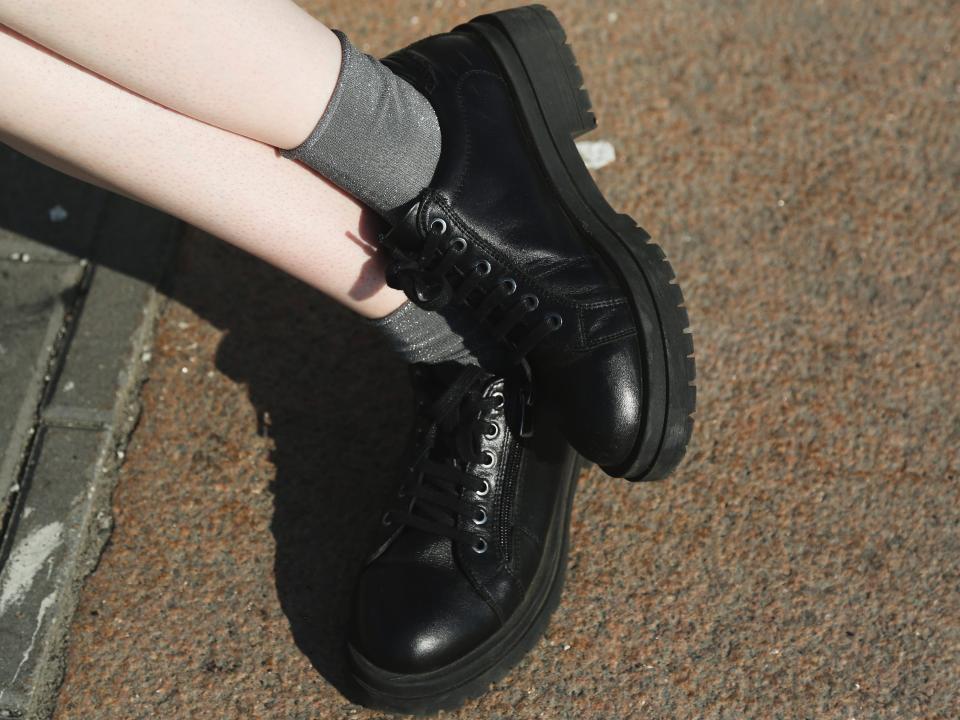 A pair of black school shoes.