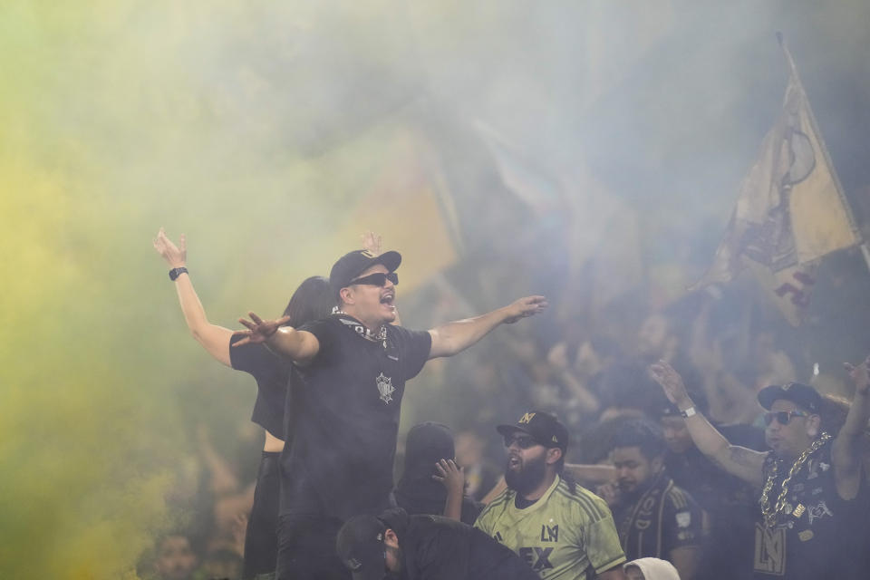 Los Angeles FC fans cheer after forward Carlos Vela scored during the second half of an MLS soccer match against the Vancouver Whitecaps in Los Angeles, Saturday, June 24, 2023. (AP Photo/Ashley Landis)