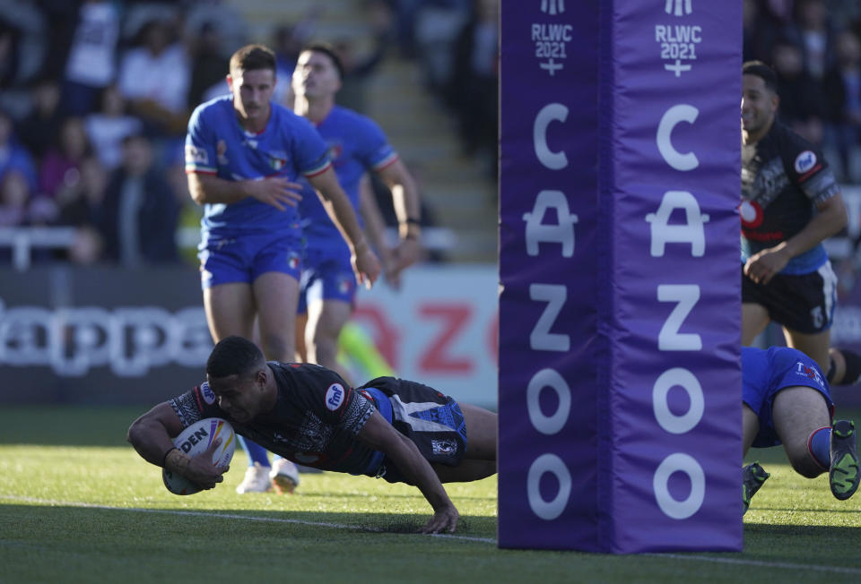Fiji's Penioni Tagituimua scores a try during the Rugby League World Cup group B match at Kingston Park, Newcastle upon Tyne, England, Saturday Oct. 22, 2022. (Owen Humphreys/PA via AP)