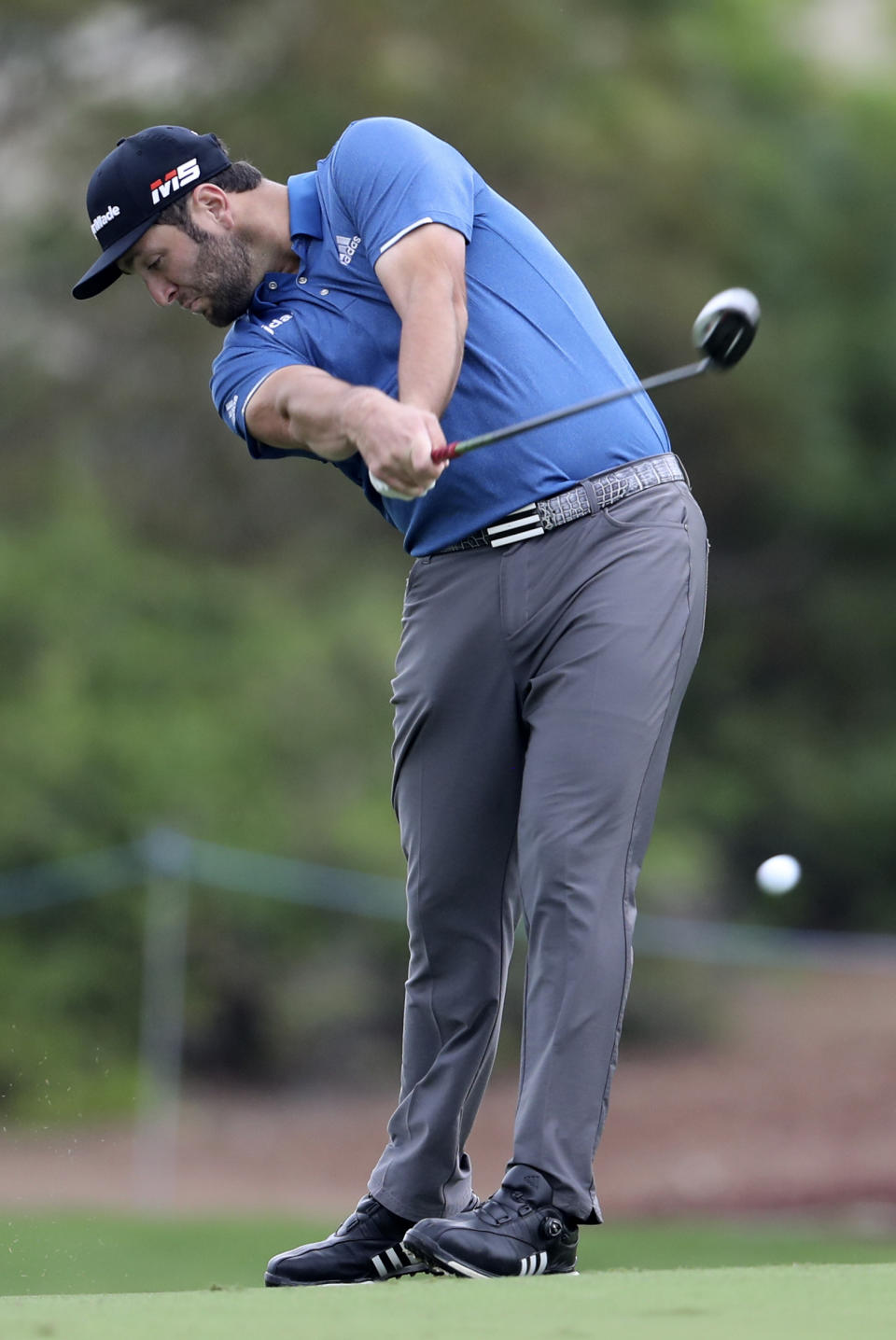 Jon Rahm of Spain plays a shot on the 2nd hole during the first round of the DP World Tour Championship golf tournament in Dubai, United Arab Emirates, Thursday, Nov. 21, 2019. (AP Photo/Kamran Jebreili)