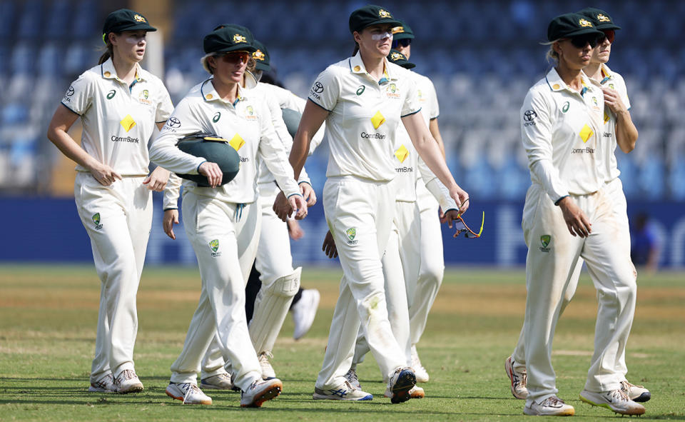 Aussie players, pictured here after their loss to India in the women's cricket Test.