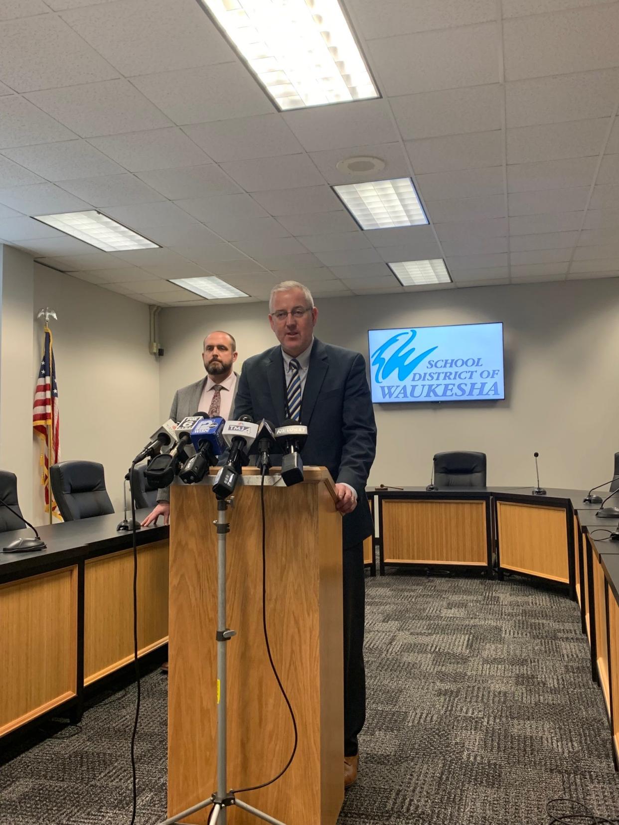 Waukesha School District superintendent James Sebert addresses the media during a press conference Nov. 29 while Waukesha School District deputy superintendent Joe Koch (background) looks on to talk about the first day back to school for students and staff since the Nov. 21 Waukesha Christmas Parade incident.