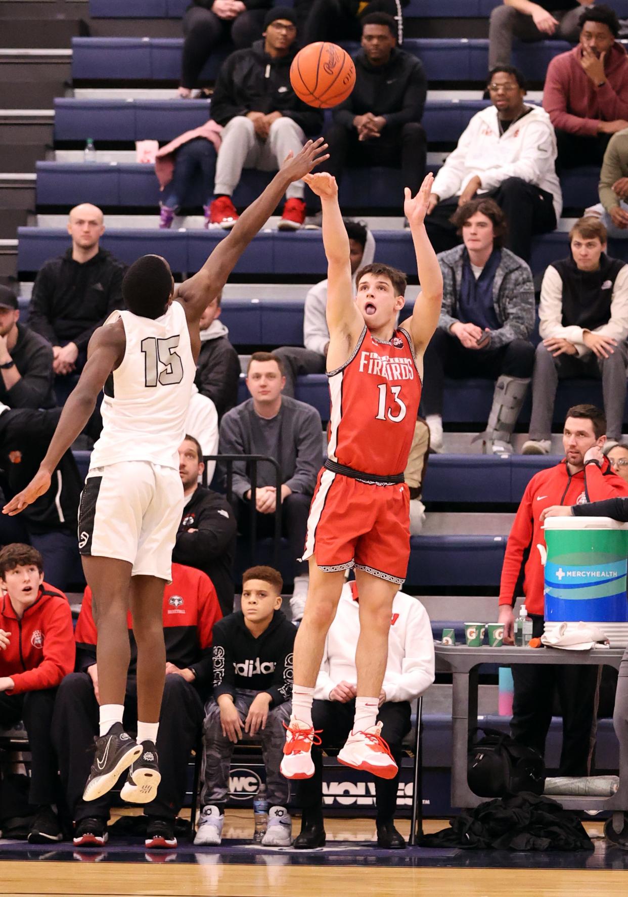 Lakota West guard Nathan Dudukovich attempts a three-pointer in the sectional playoff game between Lakota West and Lakota East high schools at West Clermont High School Feb. 25, 2022.