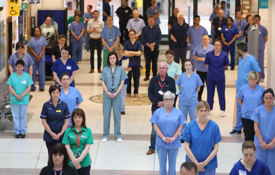 NHS staff at the Mater hospital in Belfast, during a minute's silence to pay tribute to the NHS staff and key workers who have died during the coronavirus outbreak. (Photo by Peter Morrison/PA Images via Getty Images)